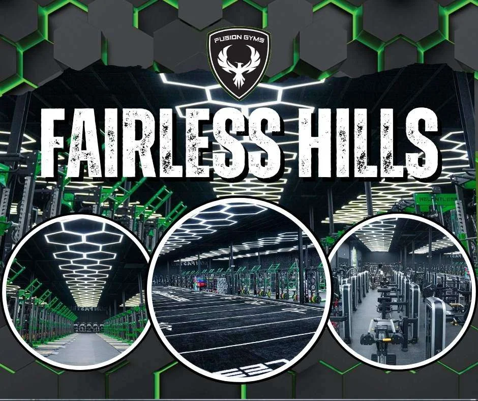 Fusion Gyms Fairless Hills: turf lane and strength floor under hexagon lights, and rows of strength machines